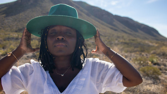 Person wearing an Ebenezer Hats hunter green silk-lined fedora